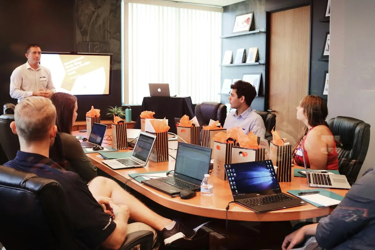 Sales team meeting around a table